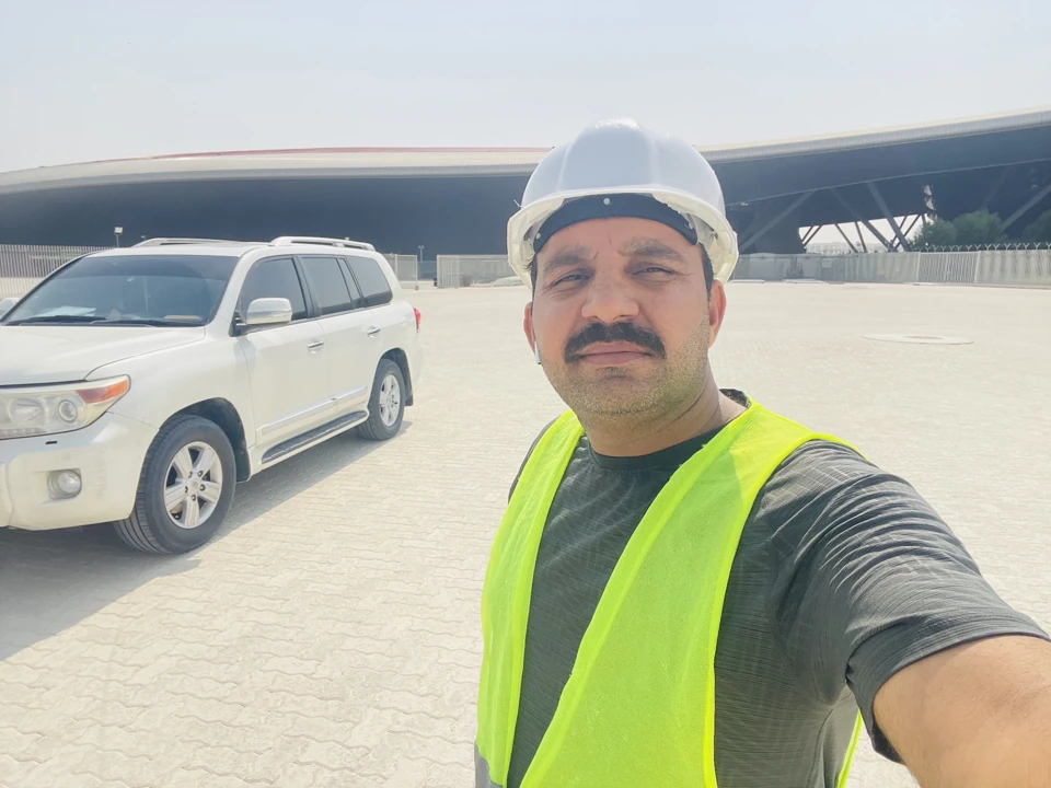 Client photograph of a worker wearing a hard hat and safety vest